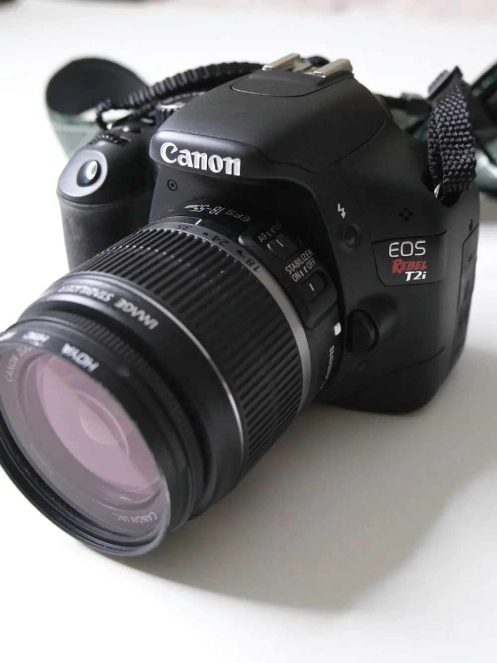 Canon T2i Rebel DSLR camera with bag, viewfinder, etc
